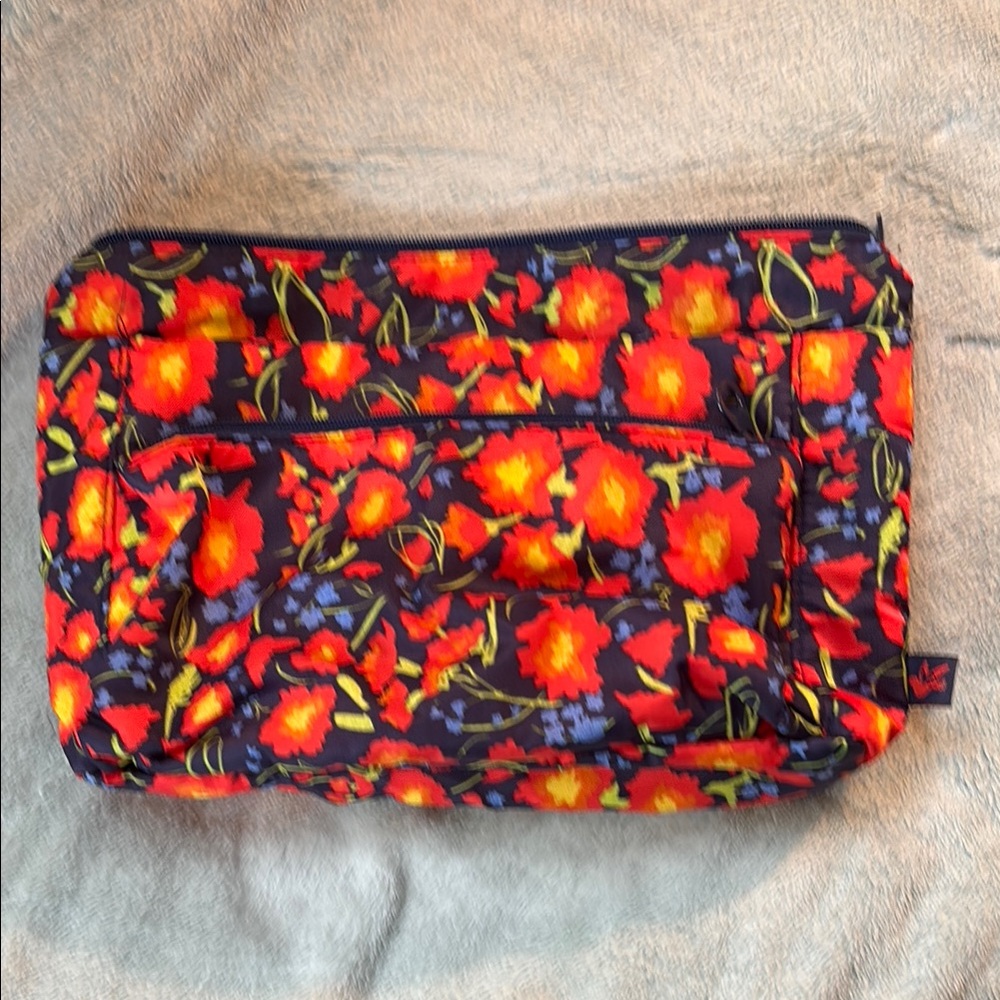 Make up bag. Floral Patterned with multiple pockets and zipper pockets